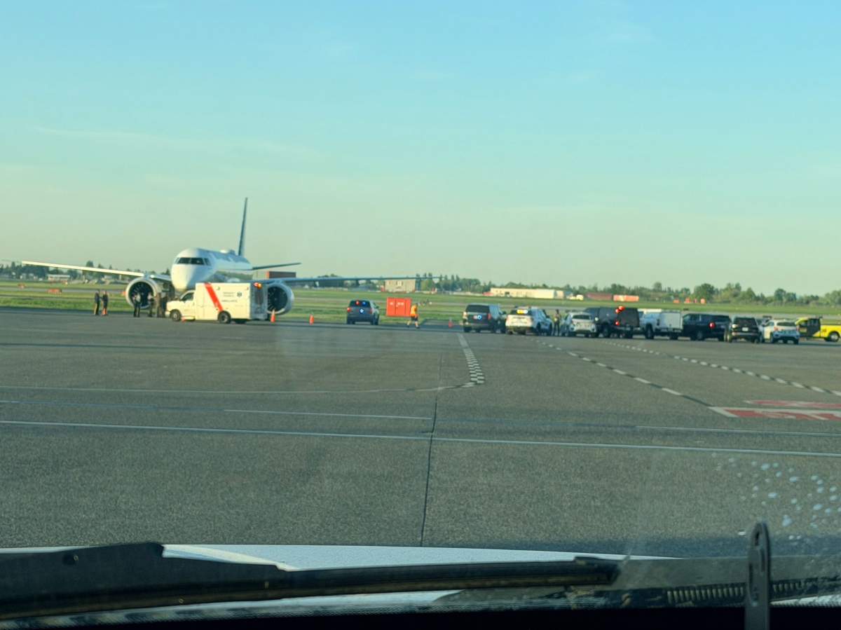 RCMP and security officials on a runway at Vancouver's International Airport on Monday morning.