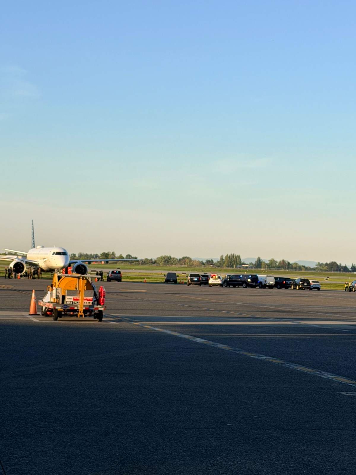 RCMP and security officials on a runway at Vancouver's International Airport on Monday morning.