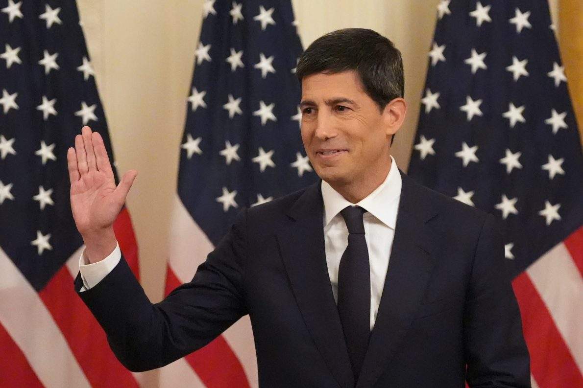 Kevin Warsh gestures as President Donald Trump speaks during Warsh's swearing in as Chairman of the Federal Reserve in the East Room of the White House, Friday, May 22, 2026, in Washington. (AP Photo/Alex Brandon).
