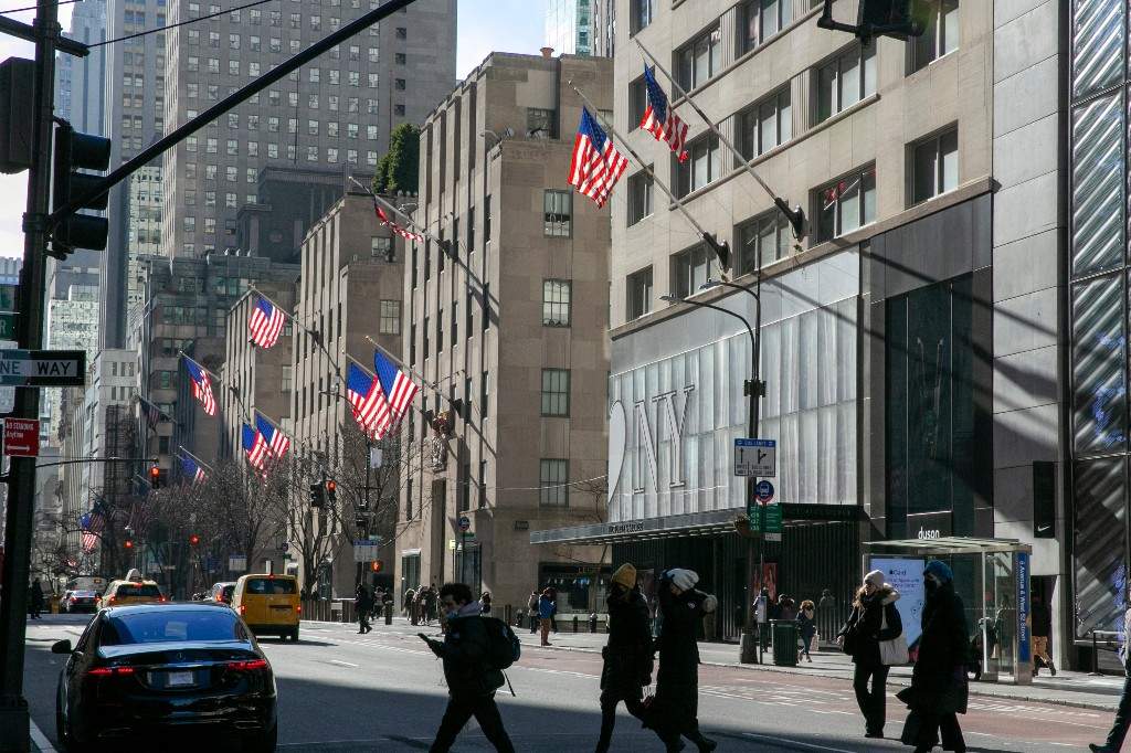 A file photo of American flags waving in the wind on Fifth Avenue in the borough of Manhattan in New York City on Friday, Jan. 21, 2022.