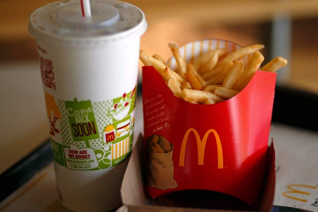 A file photo of a large order of fries and drink are photographed at a McDonald's restaurant in Robinson Township, Pa.