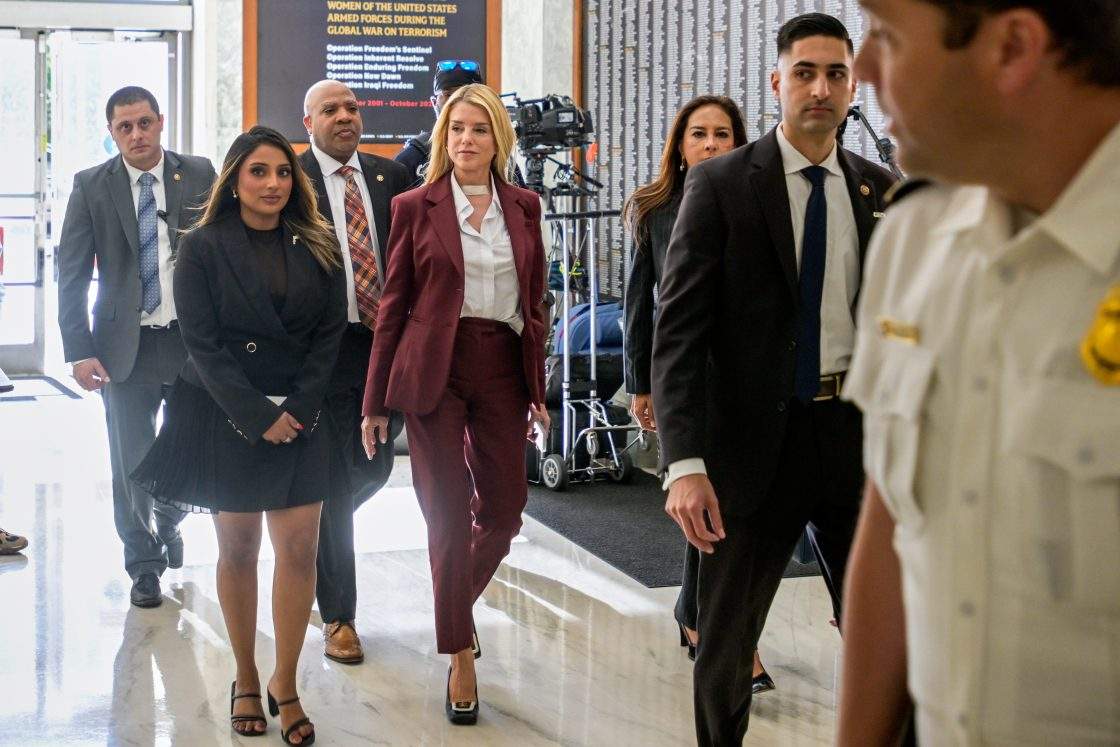 Former Attorney General Pam Bondi, center, arrives for her deposition at the Rayburn House Office Building on Capitol Hill, Friday, May 29, 2026, in Washington.