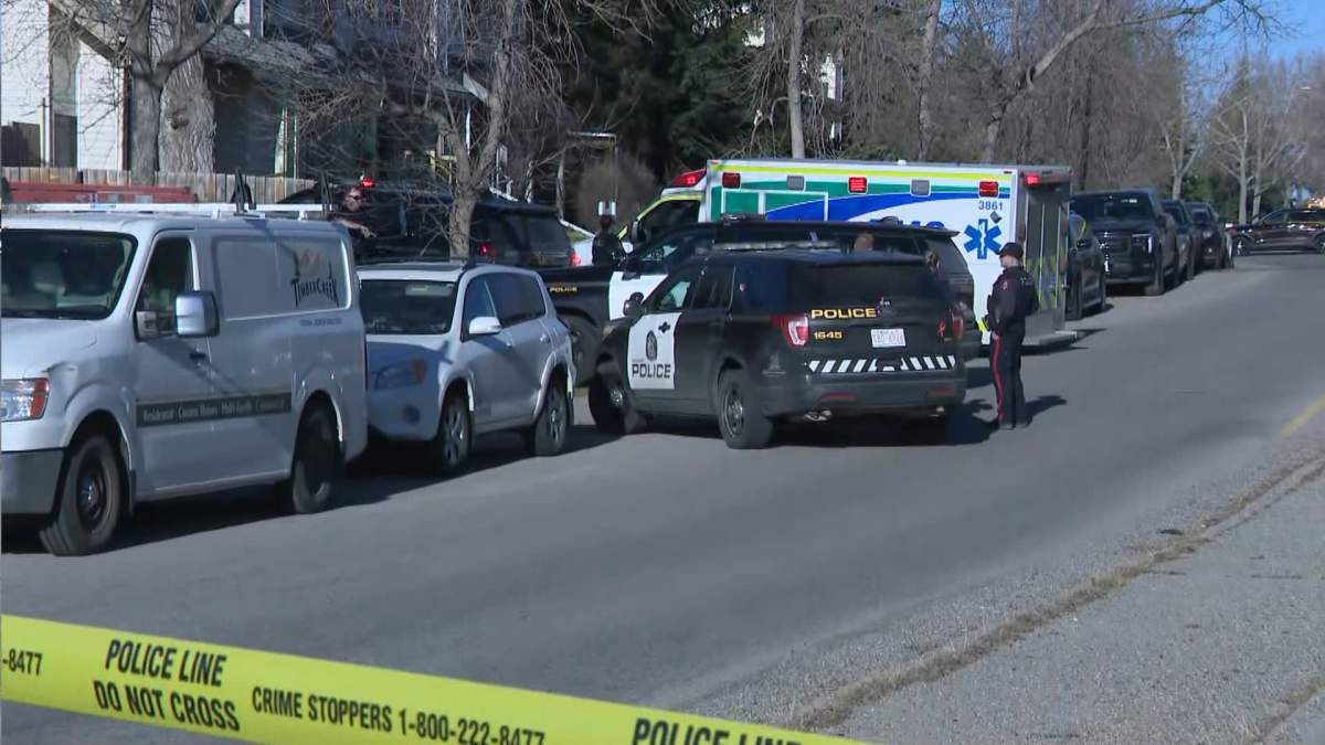 Police tape surrounds a large area along Woodview Drive SW in Calgary Wednesday morning as the CPS homicide team investigates the death of a person following a "serious assault."