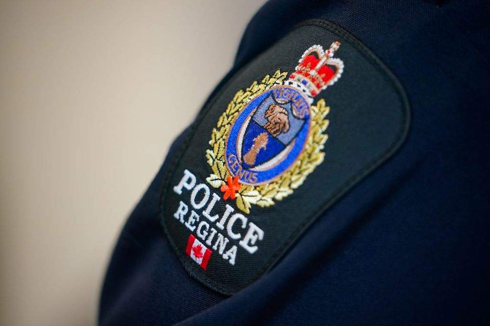 Two people were arrested by Regina police following an investigation into alleged threats to bring a firearm to a local school.