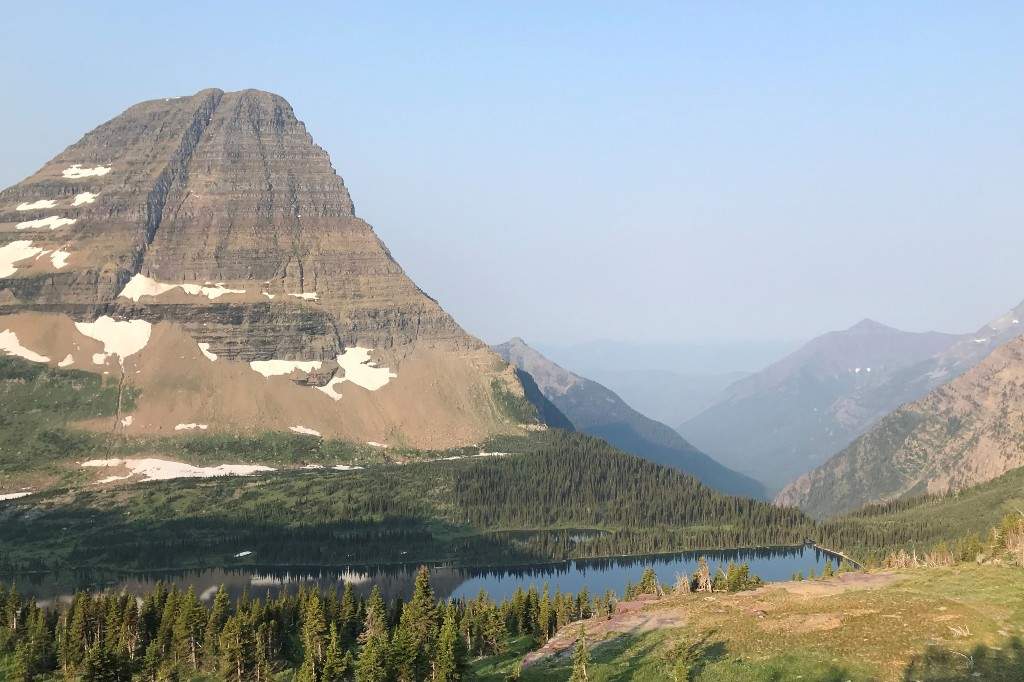 Mount Brown, second peak from left, is tucked behind Bearhat Mountain, far left, at Glacier National Park on Aug. 1, 2018, in West Glacier, Mont.