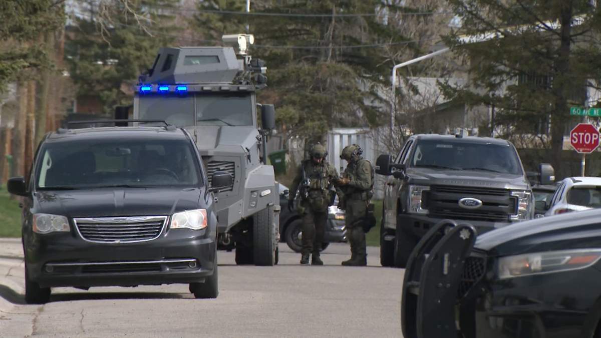 Heavily armed members of the Calgary police tactical team, along with an armoured vehicle were called out to Trollinger Street, in the northeast community of Thorncliffe around 9 a.m. on Monday.