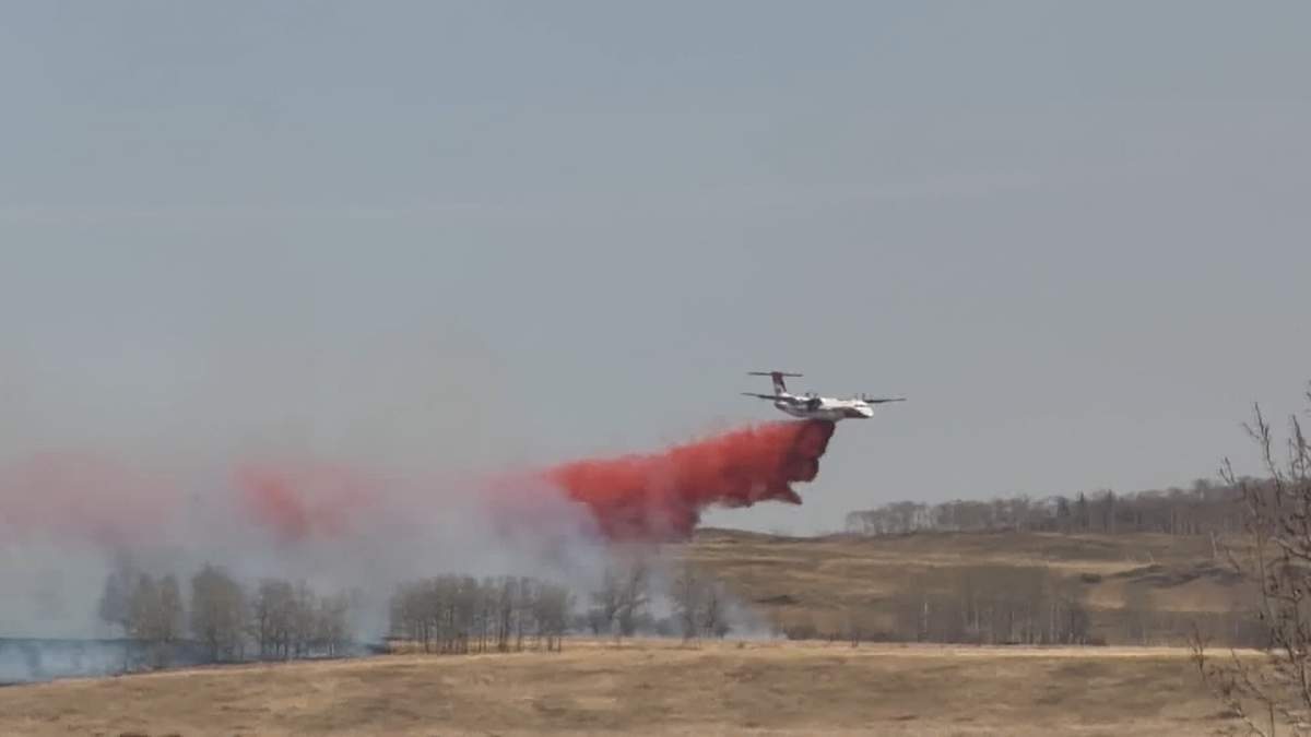 The Rocky View County fire department was forced to call in support from Alberta Wildfire and surrounding fire departments as they scrambled to contain a large brush fire near Ghost Lake on Thursday.