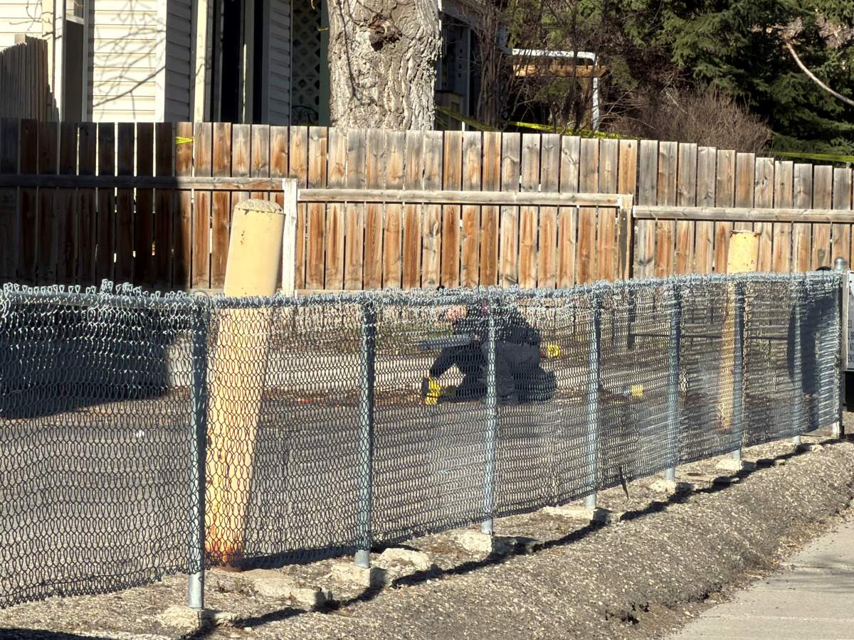 A large number of police evidence markers could be seen along Woodview Drive SW on Wednesday morning as Calgary police investigated the death of a person following a "serious assault."