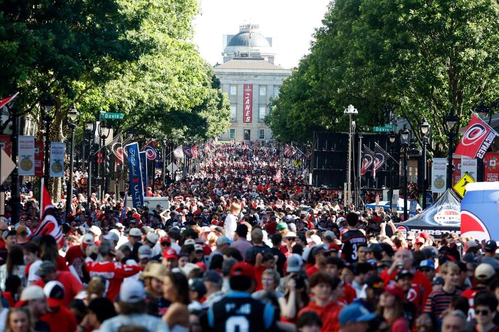 Carolina Hurricanes fans crowd onto Fayetteville Street prior to the start of the Stanley Cup Championship celebration in Raleigh, N.C., Saturday, June 20, 2026. (AP Photo/Karl DeBlaker).