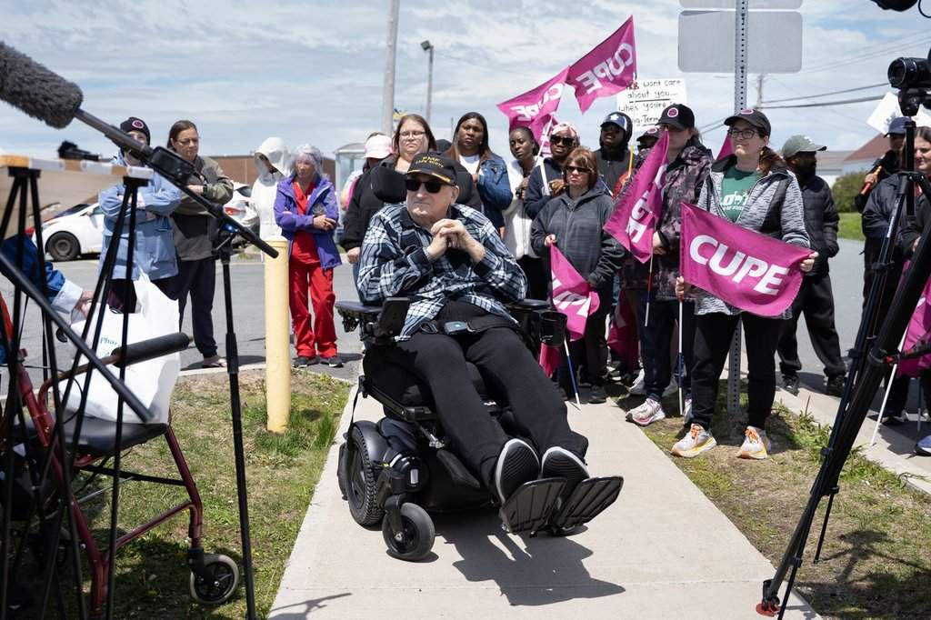 Carl Snyder, a resident at Ocean View Continuing Care Centre, joins striking long-term care workers rallying on a picket line in Eastern Passage, N.S. on Tuesday, June 2, 2026. THE CANADIAN PRESS/Darren Calabrese.