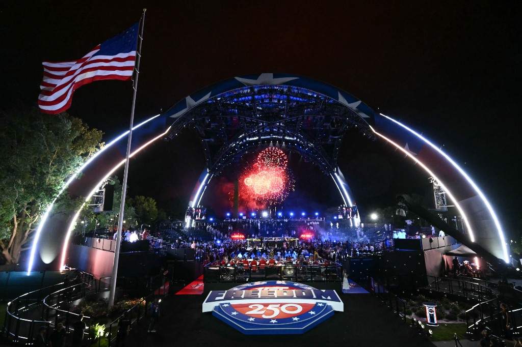 Fireworks go off as Justin Gaethje celebrates after defeating Ilia Topuria in a lightweight title bout during UFC Freedom 250 on the South Lawn of the White House, Monday, June 15, 2026, in Washington.