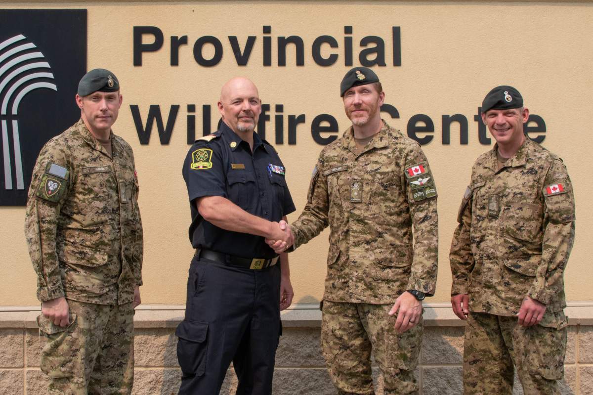 From left to right: Lieutenant-Colonel Jason Hudson, Commanding Officer 3rd Battalion, Princess Patricia’s Canadian Light Infantry (3 PPCLI), Saskatchewan Public Safety Agency president of operations Marlo Pritchard, Brigadier-General Wade Rutland, and Chief Warrant Officer Kim Doerr, Sergeant Major of 3 PPCLI, pose for a group photo in Prince Albert, Sask. on July 31, 2025.