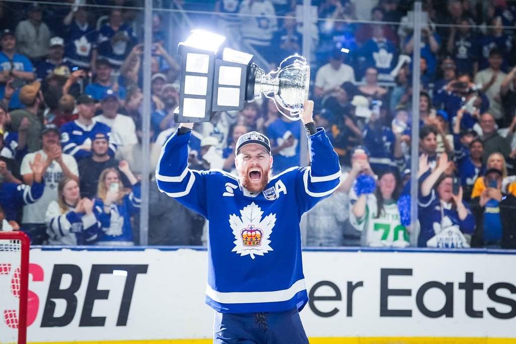Toronto Marlies defenseman Dakota Mermis (36) hoists the Calder Cup after the Toronto Marlies won Game 5 of the AHL Calder Cup Final over the Chicago Wolves in Toronto on Friday, June 19, 2026. THE CANADIAN PRESS/Arlyn McAdorey.