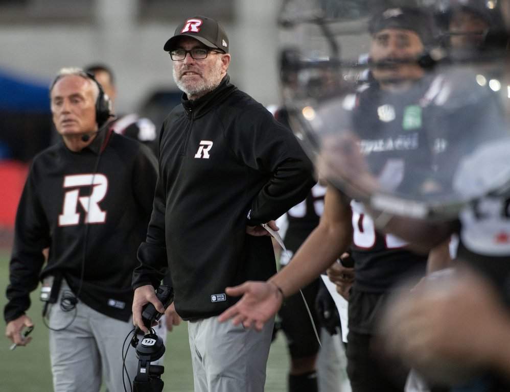 Ottawa Redblacks head coach Ryan Dinwiddie watches his team during first half CFL preseason football action against the Montreal Alouettes in Montreal, Friday, May 22, 2026. THE CANADIAN PRESS/Peter McCabe.