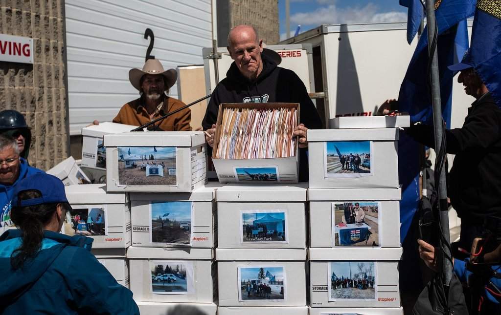 Mitch Sylvestre, head of the Alberta Prosperity Project, delivers boxes of signatures calling for a separation referendum to Elections Alberta in Edmonton, on Monday, May 4, 2026.