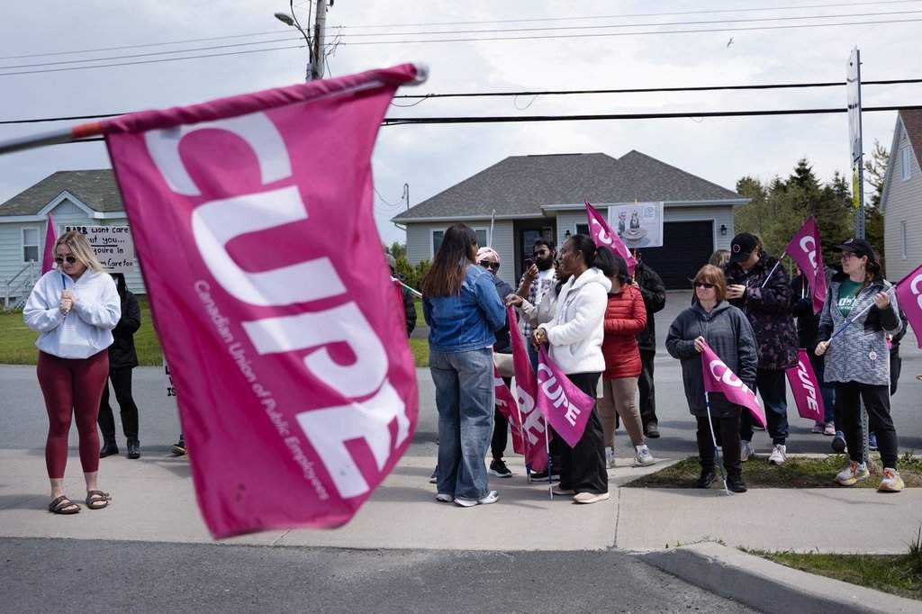 Long-term care workers are seen on a picket line in Eastern Passage, N.S., on Tuesday, June 2, 2026. THE CANADIAN PRESS/Darren Calabrese.