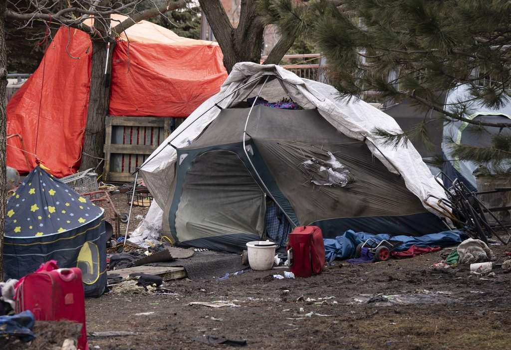 Tents are seen at an unhoused encampment in Montreal on Wednesday, April 1, 2026.  