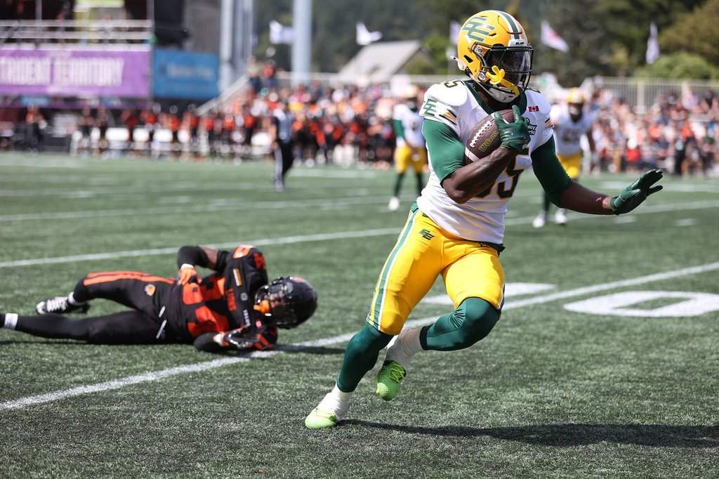 B.C. Lions' Zander Horvath misses tackling Edmonton Elks' Jalon Calhoun during the second half of CFL pre-season football action in Langford, B.C., on Saturday, May 23, 2026. THE CANADIAN PRESS/Chad Hipolito.