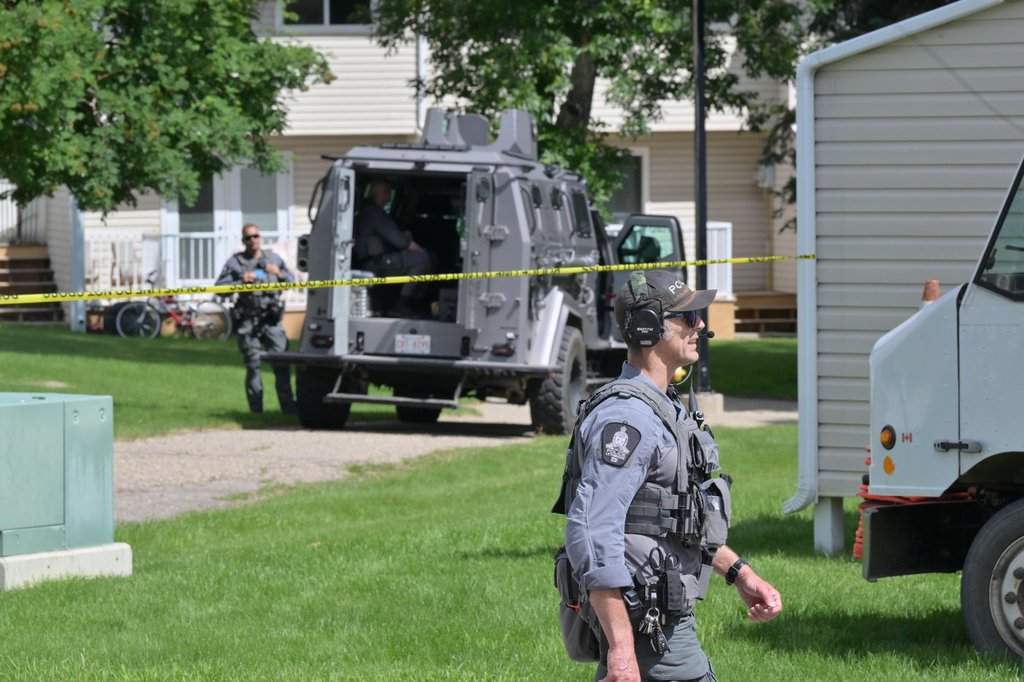 Lethbridge Police conduct a search of a home along Lemoyne Crescent, in Lethbridge, Alta., on Tuesday, June 23, 2026. THE CANADIAN PRESS/Matthew Bruce