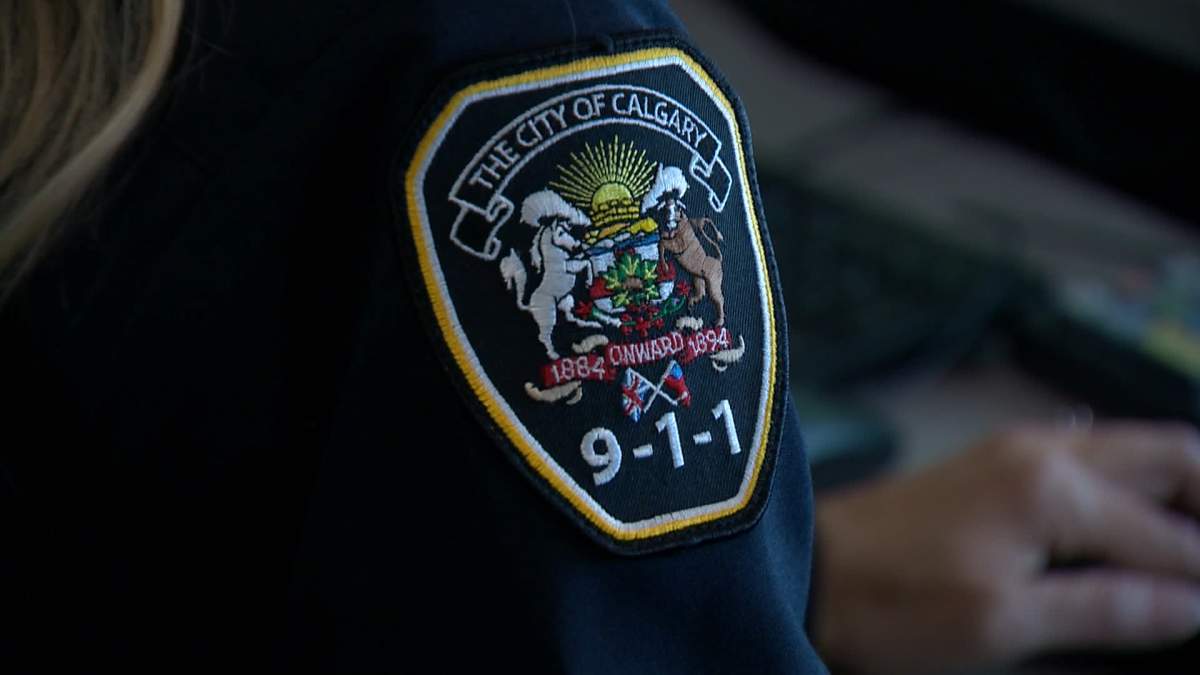 close up of Calgary 9-1-1 badge.