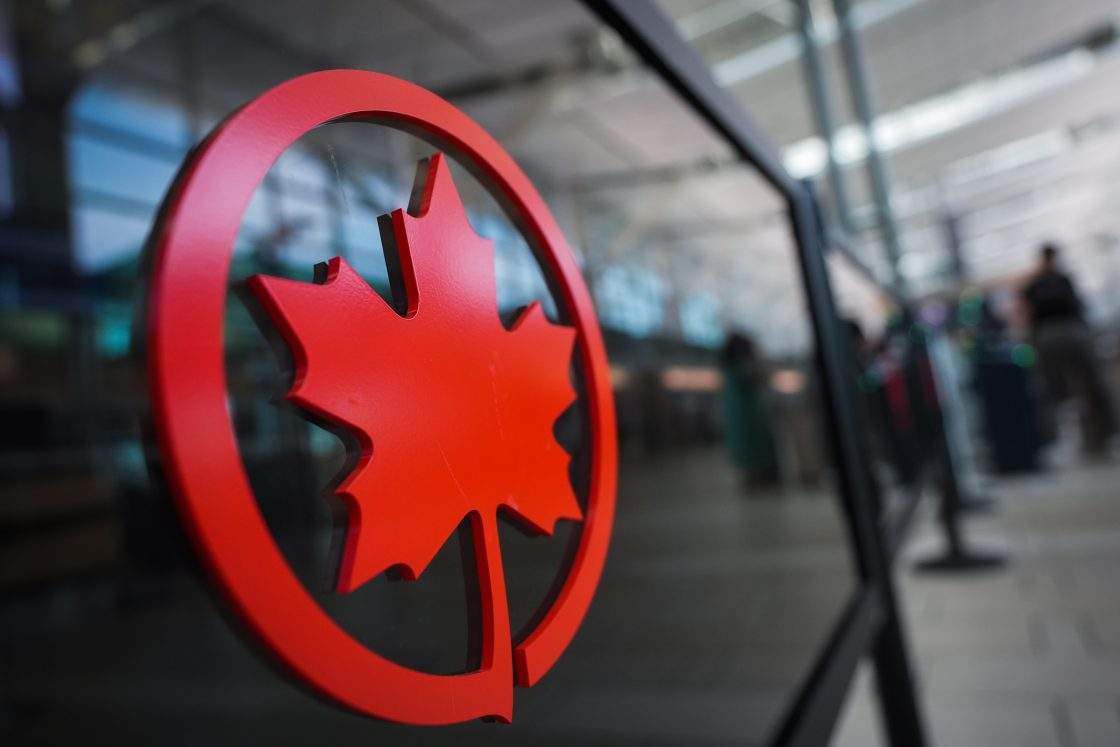 FILE - An Air Canada logo is seen on a partition at Vancouver International Airport, in Richmond, B.C., on Aug. 13, 2025.