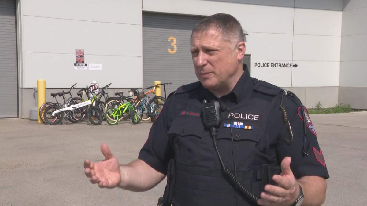 Calgary Police Service Sgt. Nick Wilsher speaks to Global News with a collection of recovered stolen bikes in the background. Wilsher says the city’s partnership with Bike Index has helped return hundreds of stolen bikes to owners, with a total value of roughly $330,000 to date.