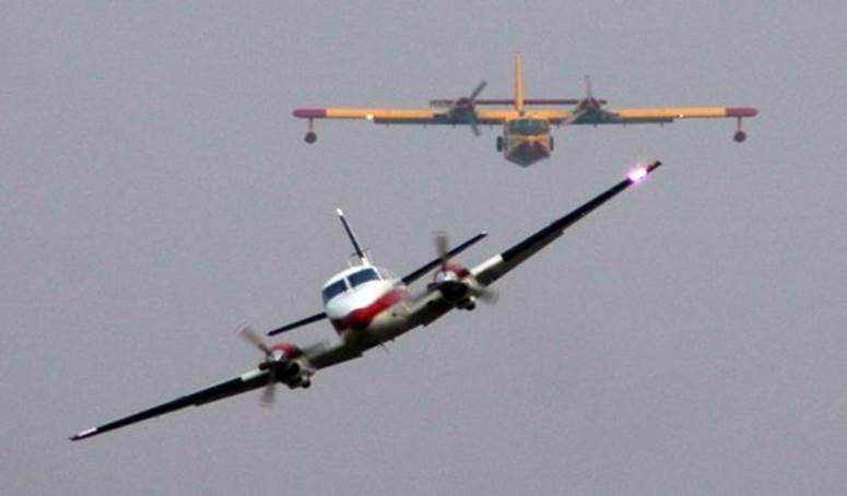 File photo of a fixed-wing Turbo Commander AC960 “bird dog” plane flying ahead of a wildfire air tanker in the Northwest Territories.