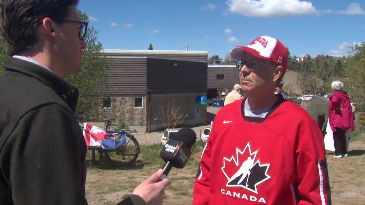 Brad Tomlinson, wearing a Team Canada hockey jersey with with “Never 51” on the back, has volunteered for the Forever Canadian movement.