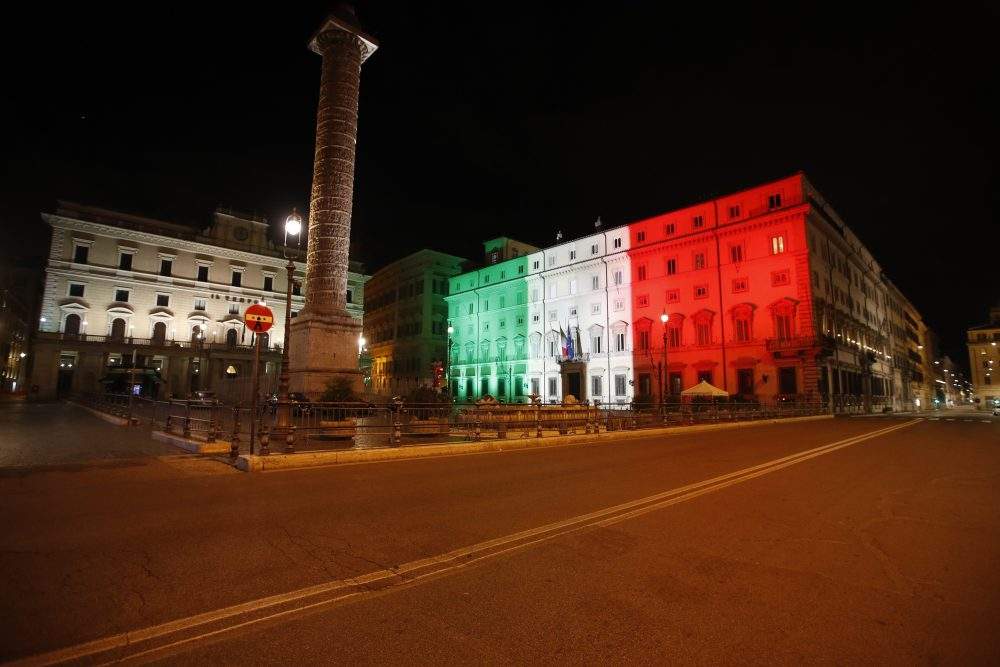 FILE – The Palazzo Chigi Government office is lit with the colour of the Italian flag, Oct. 26, 2020.