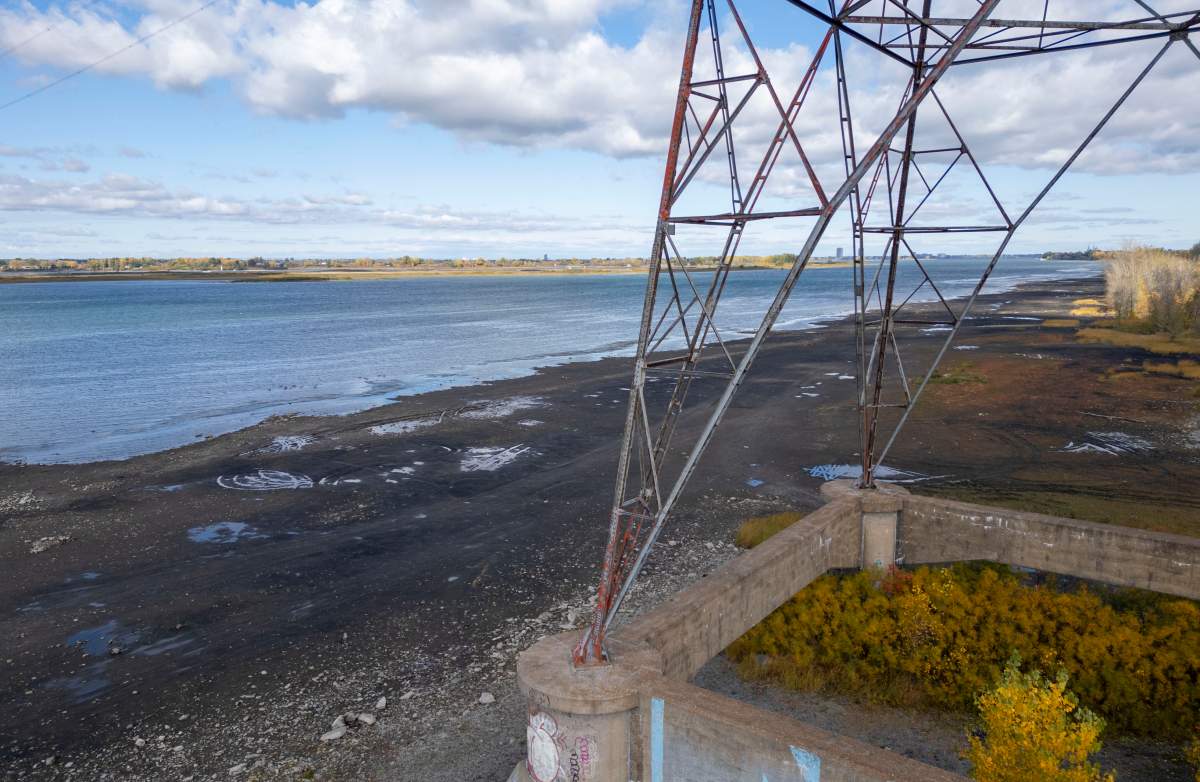 Low water levels are seen in this aerial view of the shoreline in the Montreal suburb of Boucherville on the south shore of the St. Lawrence River on Wednesday, Oct. 8, 2025. THE CANADIAN PRESS/Christinne Muschi.