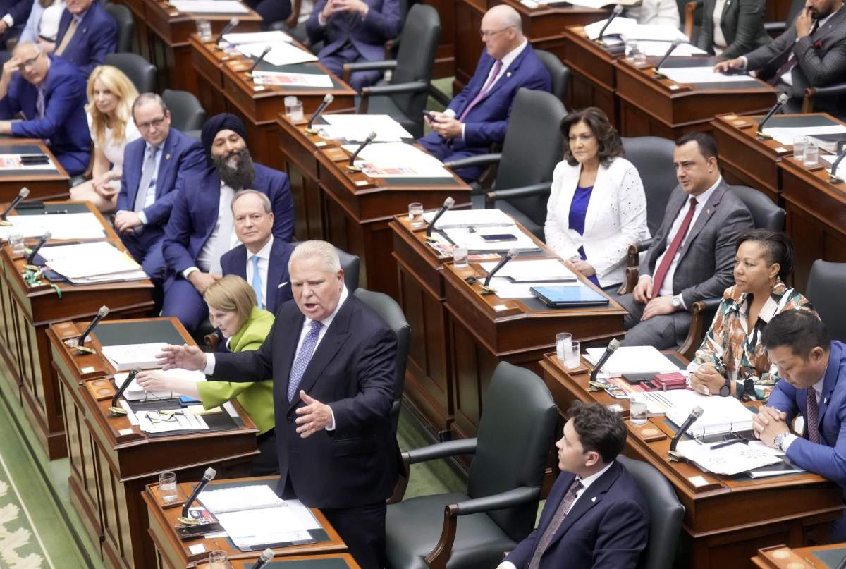 Ontario Premier Doug Ford, centre, yells at the opposition during the last sitting day in the legislature before summer break at Queen's Park in Toronto on Tuesday, June 2, 2026. 