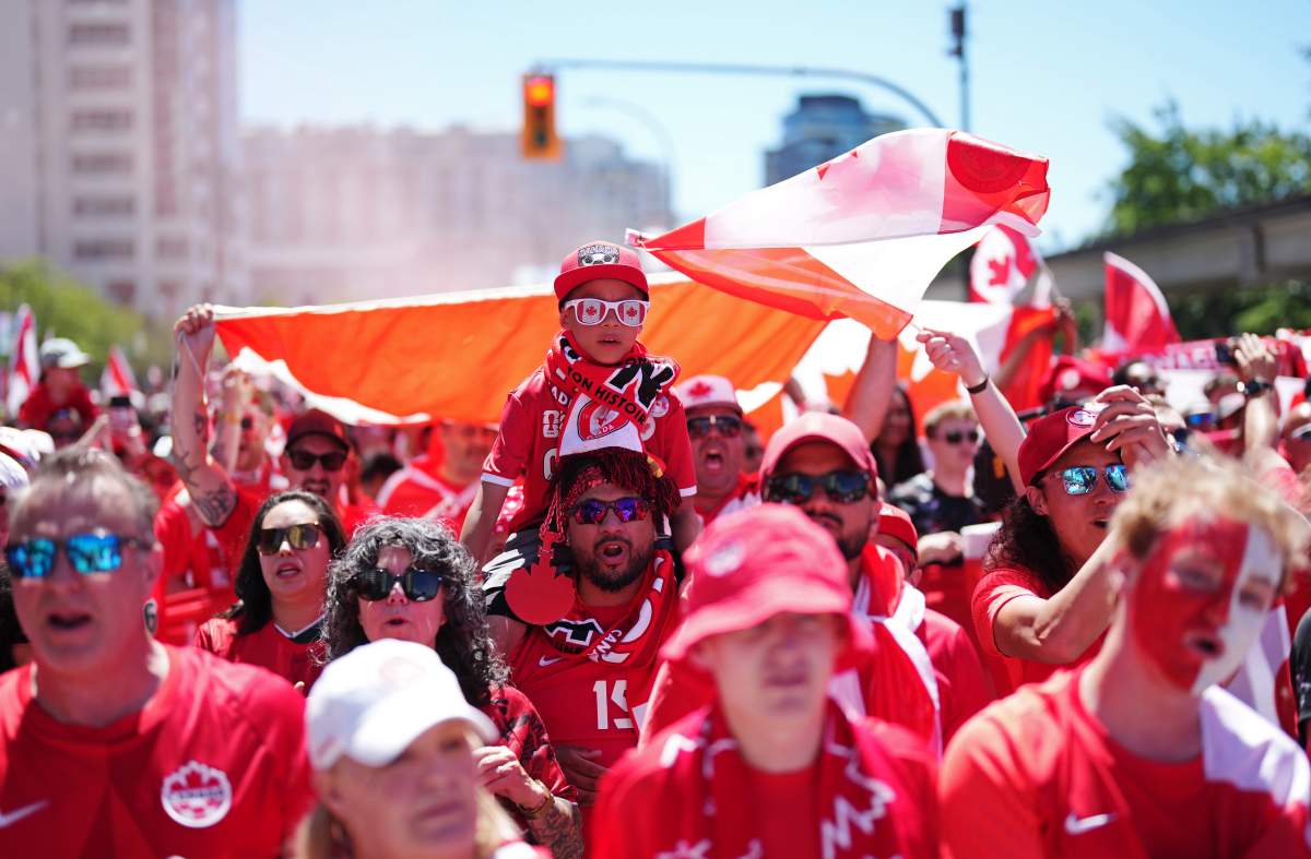 Canada soccer fans march prior to a World Cup Group B soccer match, against Qatar in Vancouver, on Thursday, June 18, 2026. THE CANADIAN PRESS/Ethan Cairns