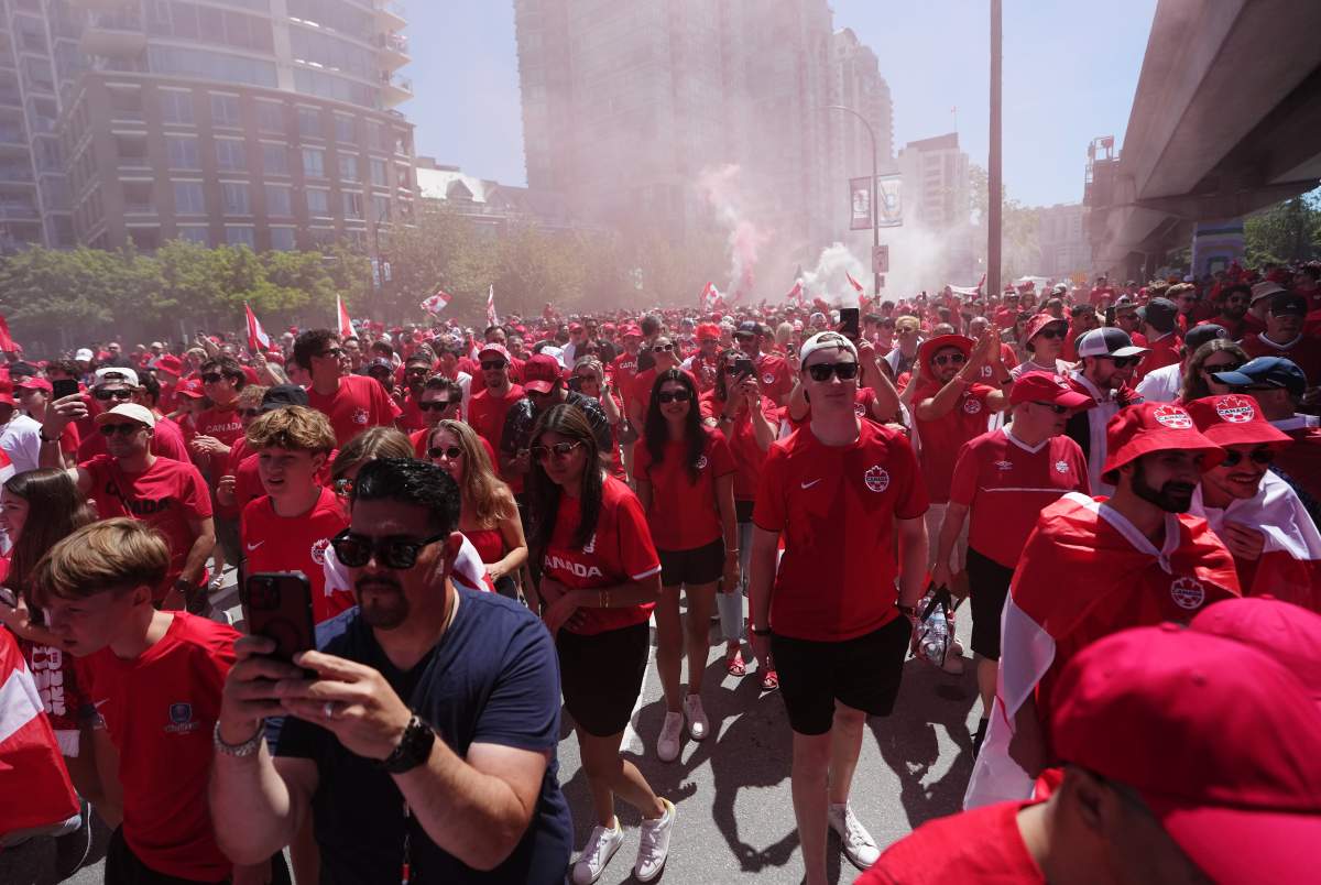 Canada soccer fans march prior to a World Cup Group B soccer match, against Qatar in Vancouver, on Thursday, June 18, 2026. THE CANADIAN PRESS/Ethan Cairns