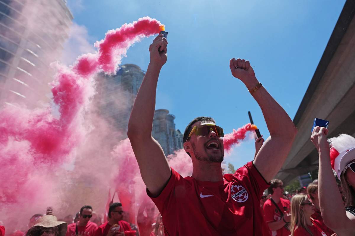 Canada soccer fans march prior to a World Cup Group B soccer match, against Qatar in Vancouver, on Thursday, June 18, 2026. THE CANADIAN PRESS/Ethan Cairns
