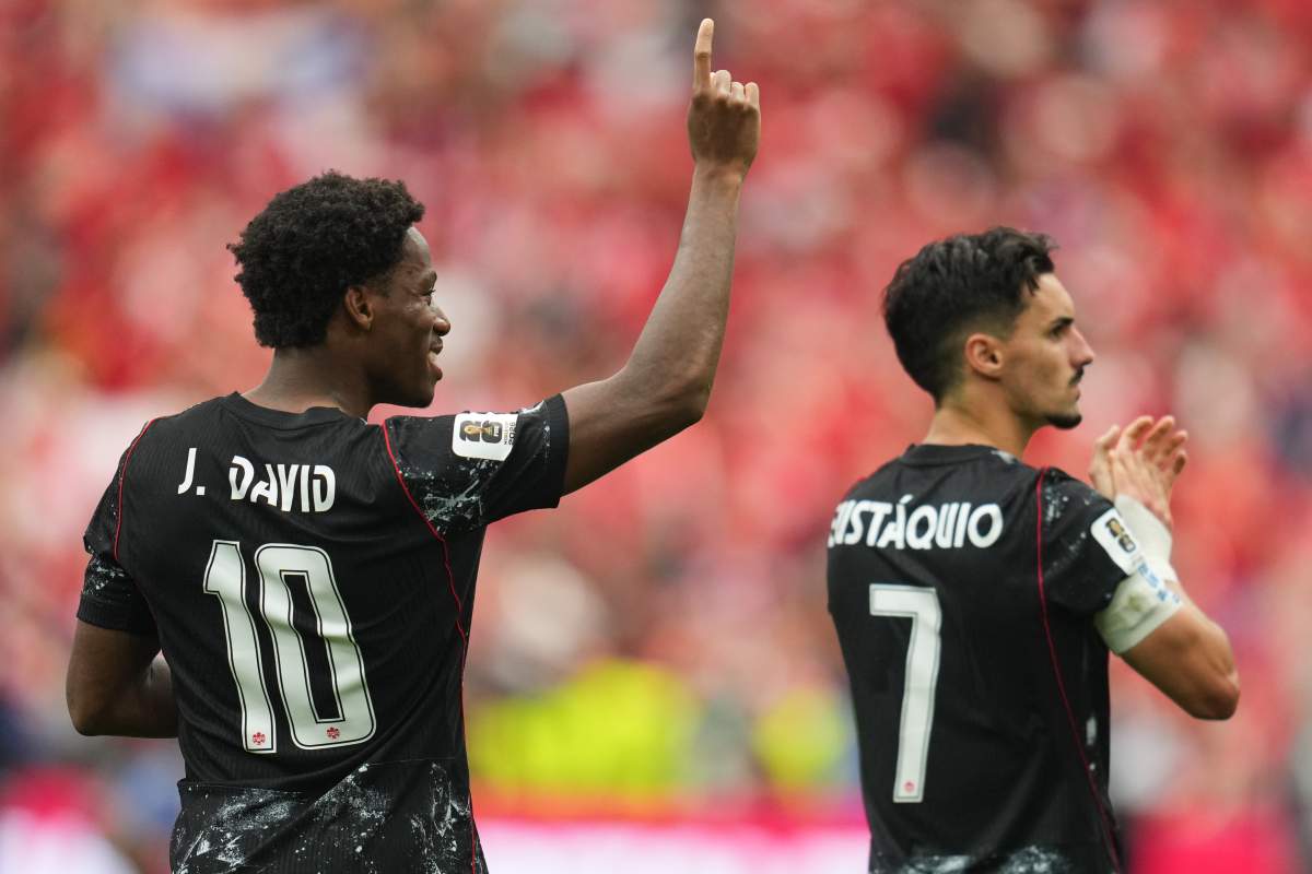 Canada’s Jonathan David, left, and Stephen Eustaquio celebrate their team’s win in the World Cup Group B soccer match against Qatar in Vancouver, British Columbia, Thursday, June 18, 2026.