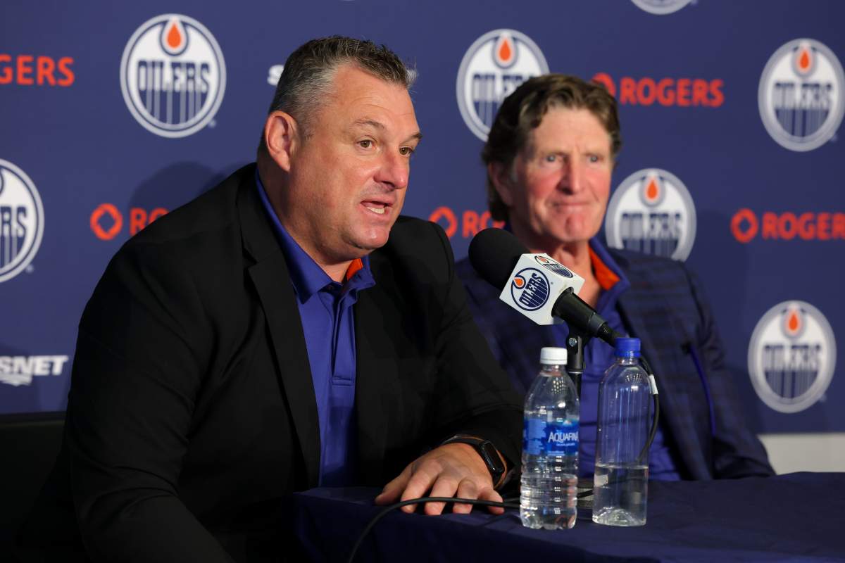 Edmonton Oilers associate coach D.J. Smith speaks to the media as head coach Mike Babcock looks on during a news conference in Edmonton on Tuesday, June 23, 2026.