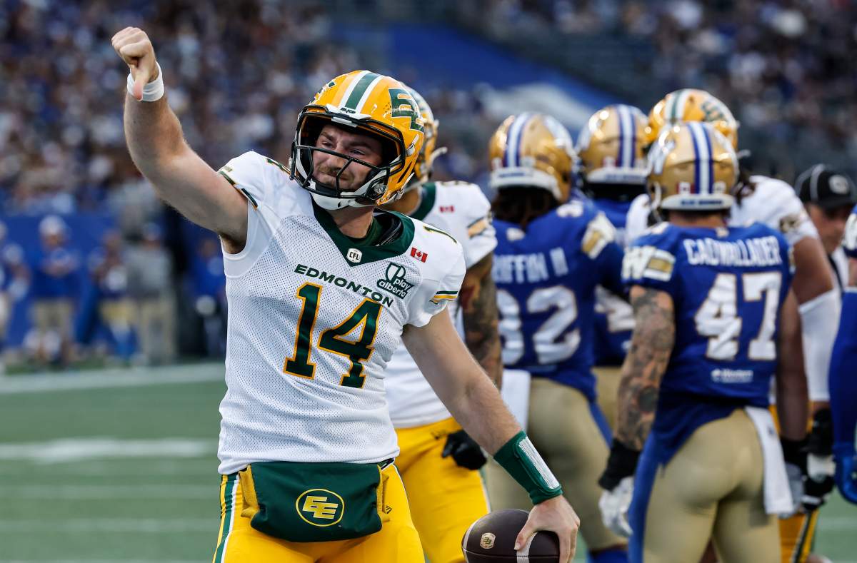 Edmonton Elks quarterback Cole Snyder (14) expresses his disagreement with a no touchdown call by the referees during first half CFL football action against the Winnipeg Blue Bombers in Winnipeg on Thursday, June 25, 2026. THE CANADIAN PRESS/John Woods.