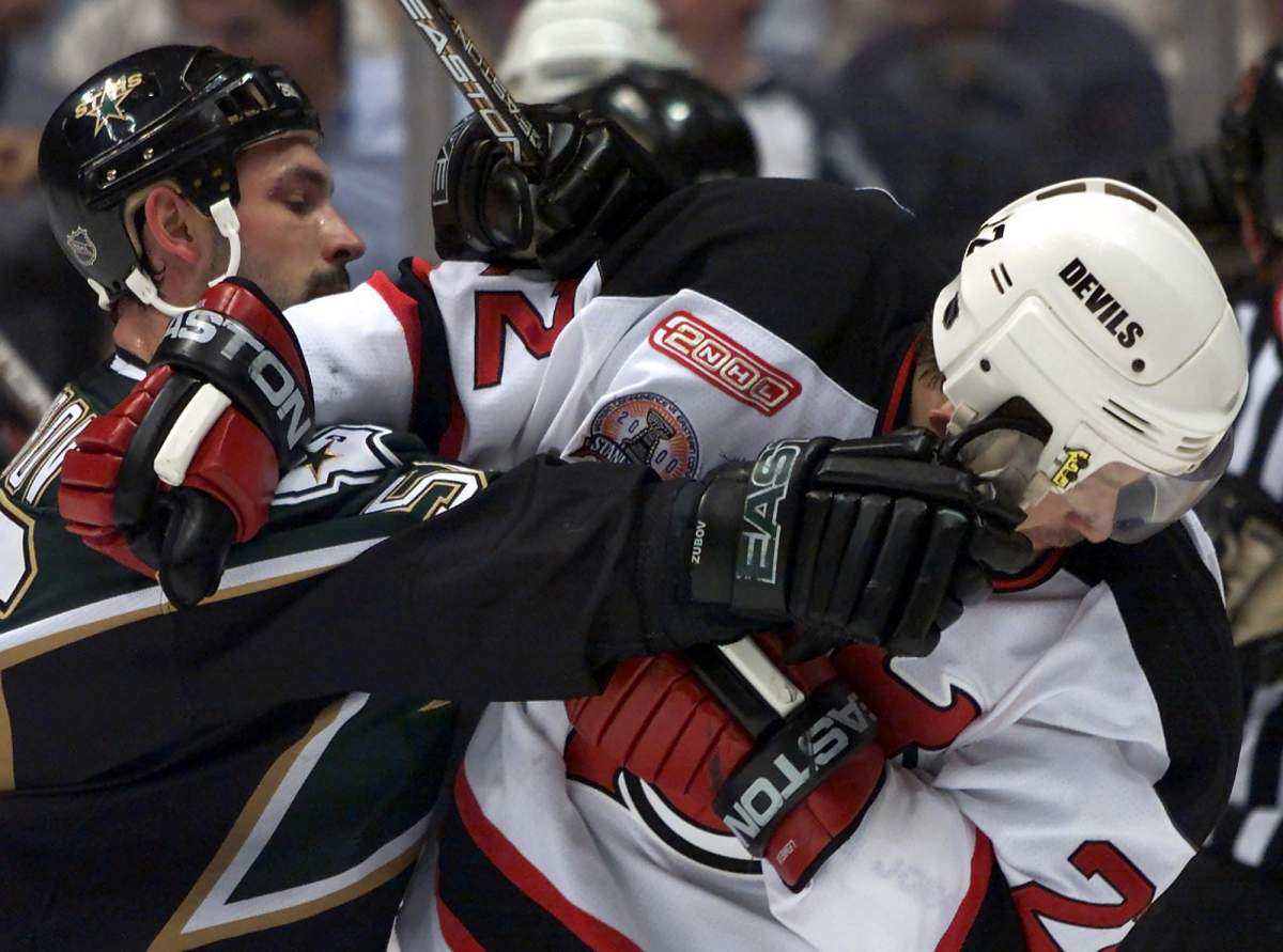 Dallas Stars defenceman Sergei Zubov (Left) gives New Jersey Devils right winger Claude Lemieux a shot in the face during a scuffle in first period Stanley Cup game 2 action in East Rutherford, NJ on Thursday June 1, 2000.
