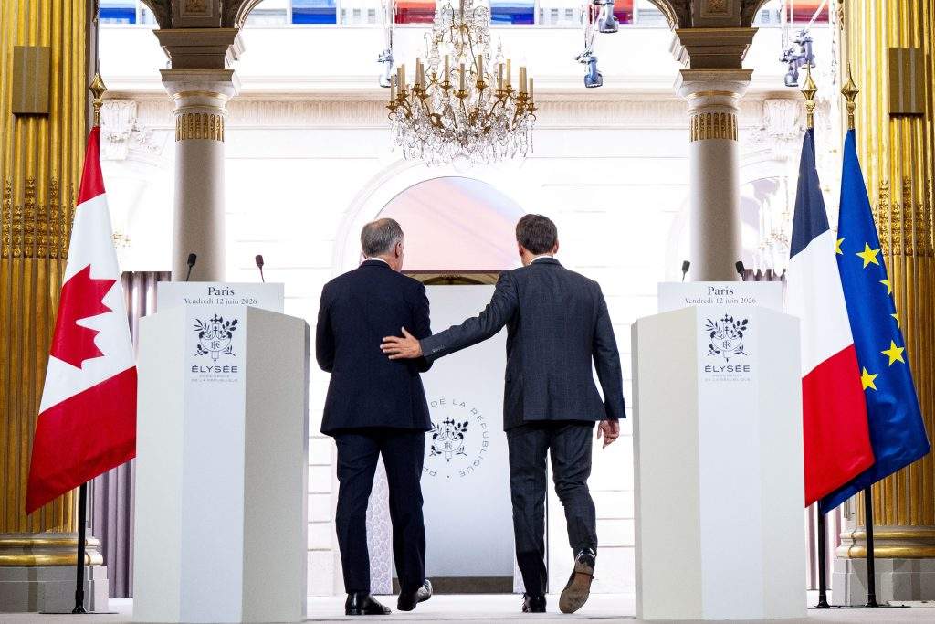 Canadian Prime Minister Mark Carney, left, and French President Emmanuel Macron exit after giving remarks at the Palais de l’Elysee in Paris, on Friday, June 12, 2026.