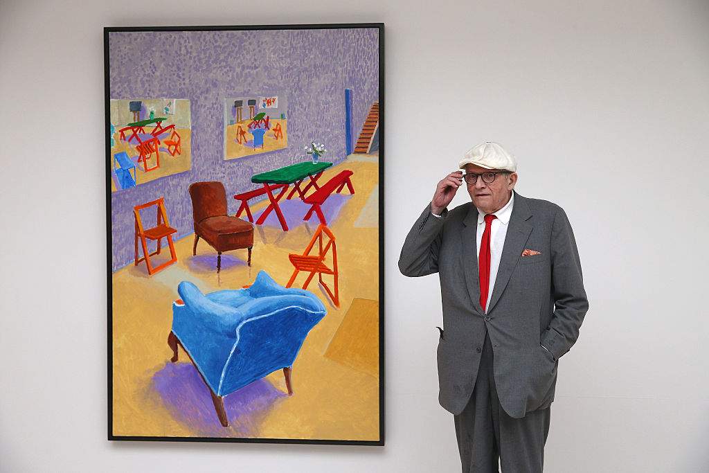 FILE: British artist David Hockney stands besides his painting entitled 'Studio Interior #14' during the launch of his new exhibition 'Paintings and Photography' at the Annely Juda fine art gallery on May 14, 2015 in London, England.