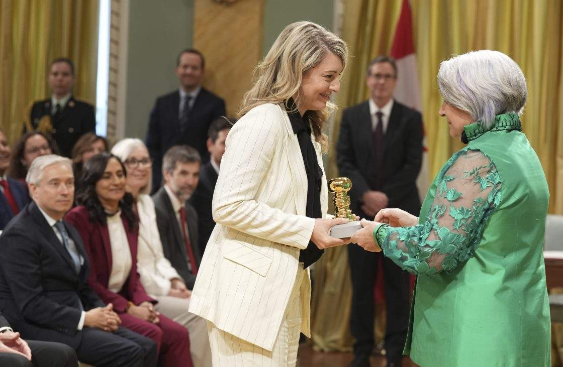 FILE – Governor General Mary Simon presents the Great Seal of Canada to Melanie Joly, Minister of Industry and Minister responsible for the Canada Economic Development for Quebec Regions, during a swearing in ceremony at Rideau Hall in Ottawa on Tuesday, May 13, 2025.