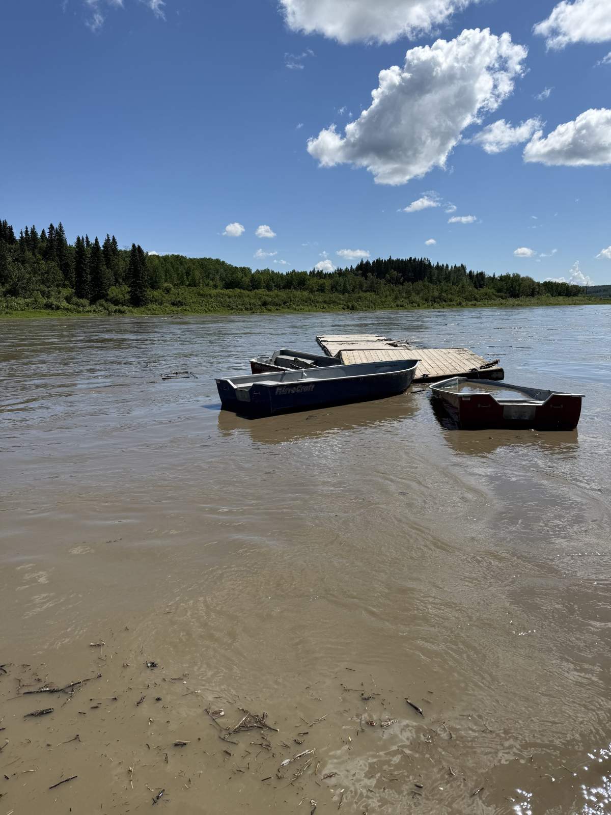 A dock and boats owned by the Edmonton Rowing Club were found several hundred kilometres downstream on the North Saskatchewan River near the town of Two Hills, Alta., on June 23, 2026.