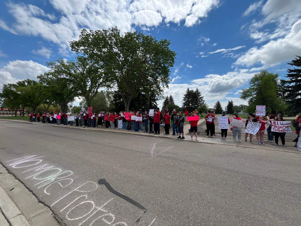 Camrose Composite High School students protest outside the Alberta school, dissatisfied with the school and police response to a series group chat messages depicting alleged musings of violent sexual assault and mutilation of girls in the community. Photo taken Wednesday, June 10, 2026.
