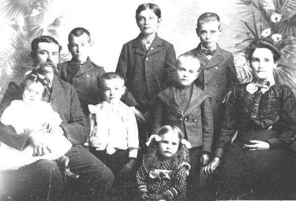 A photo provided by Tom Maher shows what he says is his Quebec ancestor (left) and his family in 1861.