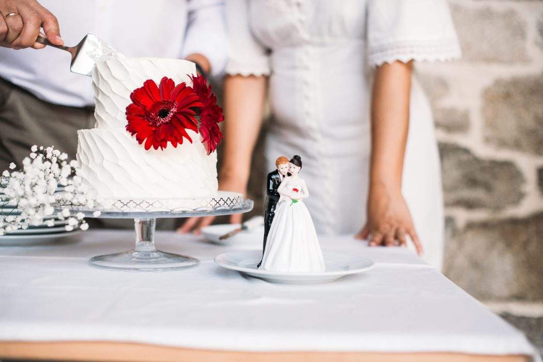 Newlywed couple and cake