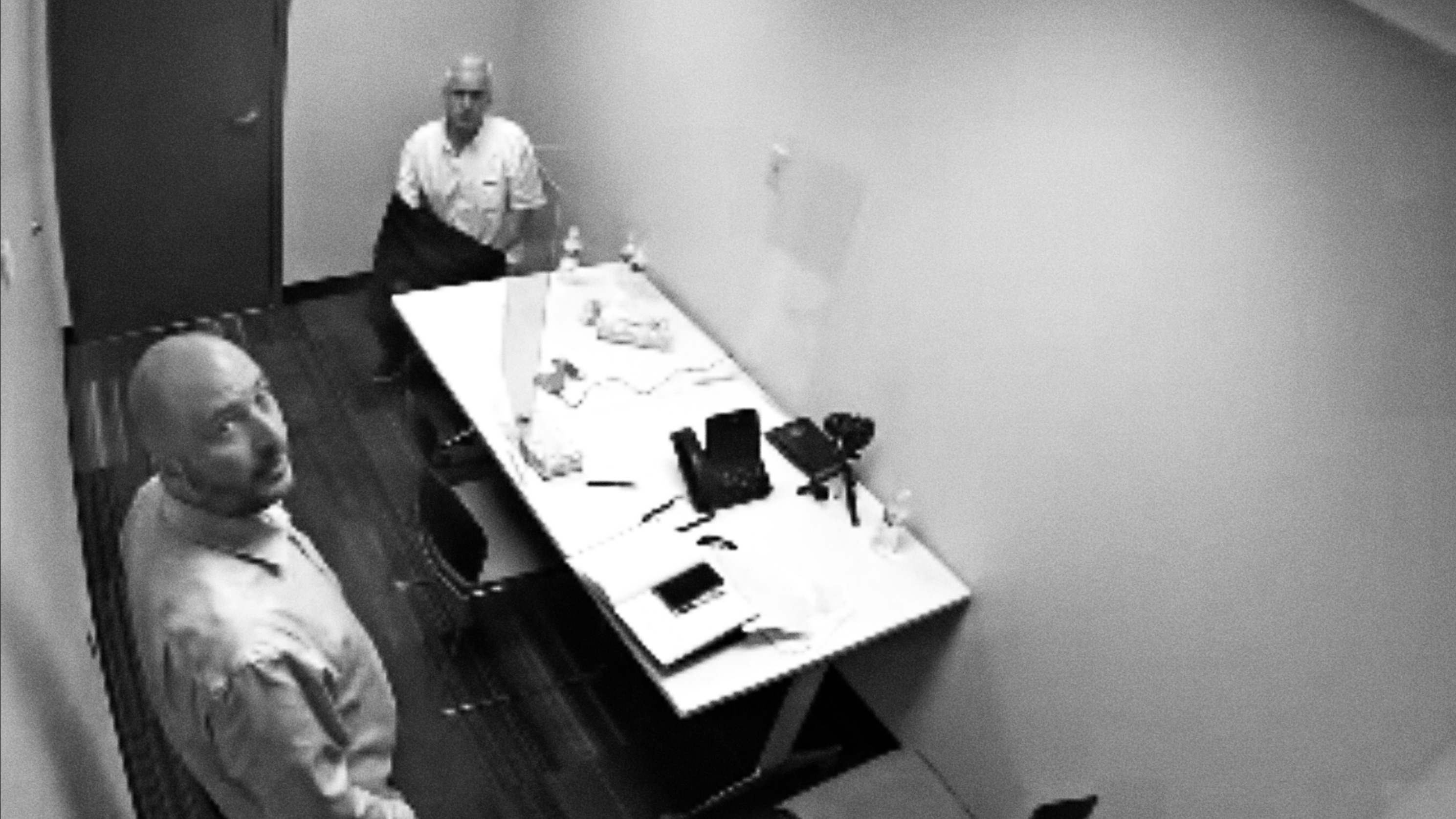 RCMP officer, left, in interview room during questioning of William Majcher, Richmond, B.C., July 18, 2023.