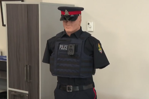 A mannequin dressed as a Lethbridge police officer wearing a body camera.