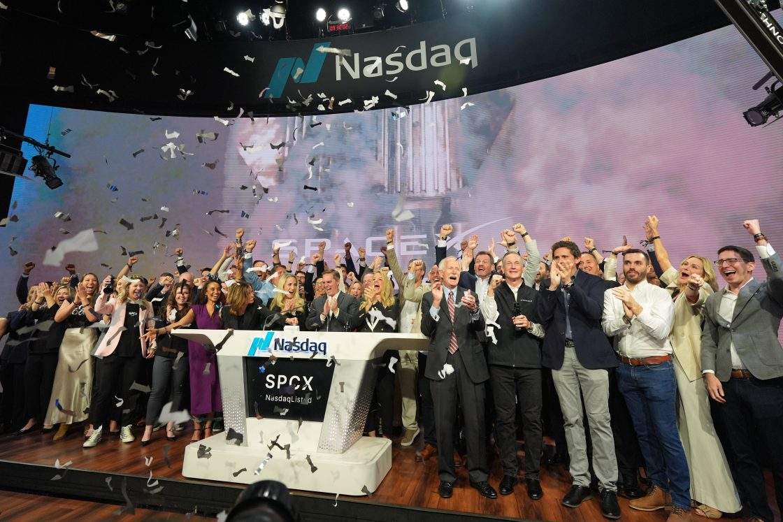 SpaceX employees celebrate during a bell ringing ceremony for the IPO of SpaceX at the Nasdaq MarketSite in New York, Friday, June 12, 2026, in New York.