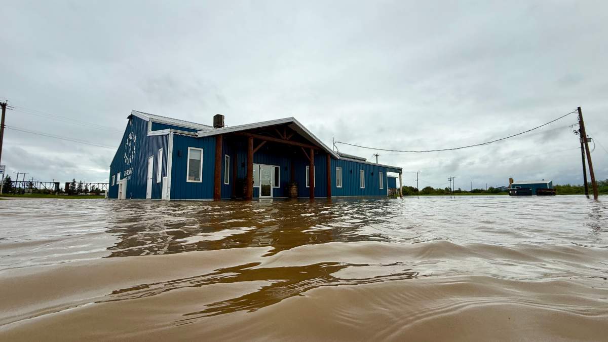 The flooded parking lot of Tofield Packers in Tofield, Alta. on Monday, June 22, 2026.