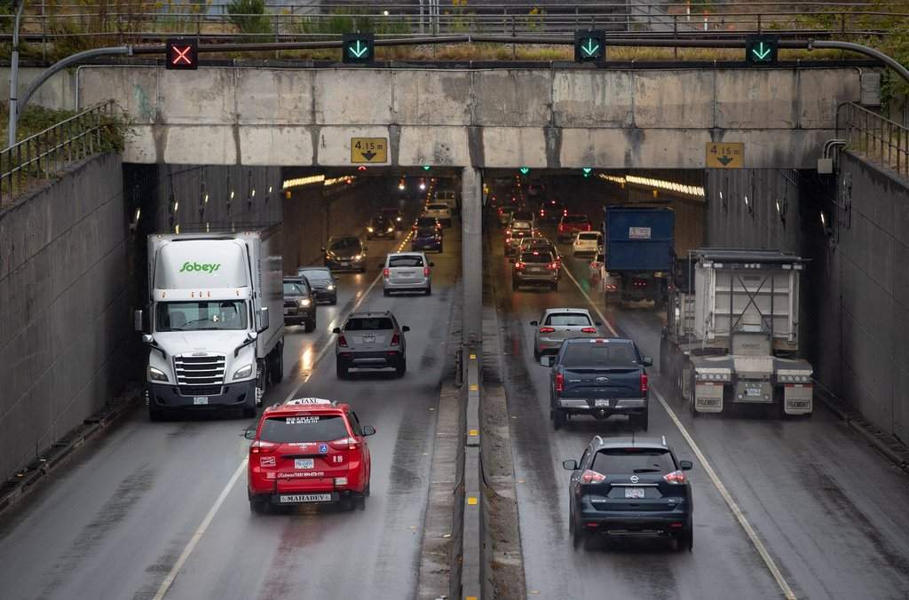 Motorists exit and enter the George Massey Tunnel in Richmond, B.C., on Friday, August 20, 2021. 